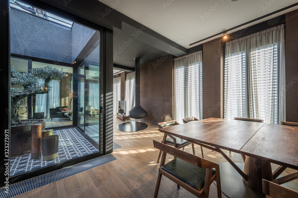 Interior of a luxury open plan apartment with fireplace Stock Photo ...