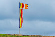 Buddhist Flags flying in a strong coastal wind
