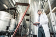 © MACO - Technician monitors processes in a steel tank with a laptop. Red Lodge, Montana, USA
