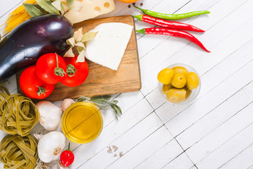 Wall Mural - mediterranean food ingredients on white wood table