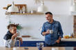 © kerkezz - Couple sitting in the kitchen and drinking coffee