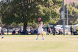 © falonkoontz - A girl with sports goggles is playing competitive soccer.