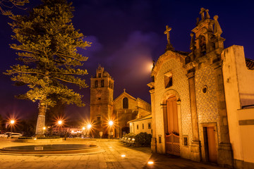 Sticker - Chapel of Nosso Senhor da Agonia in Vila do Conde, Portugal, at dusk with the Mother Church in the background.