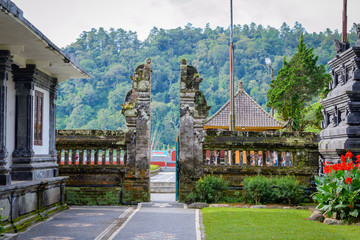 Balinese sculptures and traditional architectural details in a temple in Bali, Indonesia