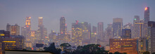 Blurry City Scape Of Public Housing In Central Singapore, Light Bokeh During Blue Hour