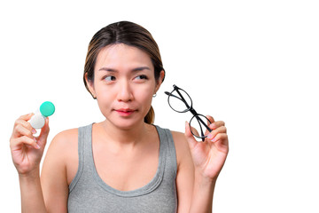 Asian woman holding glasses and contact lens on isolate on white background with clipping path, Selective focus on glasses , myopia and eyesight problem concept.