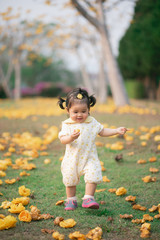 Wall Mural - portrait of cute asian baby girl in the flowers garden