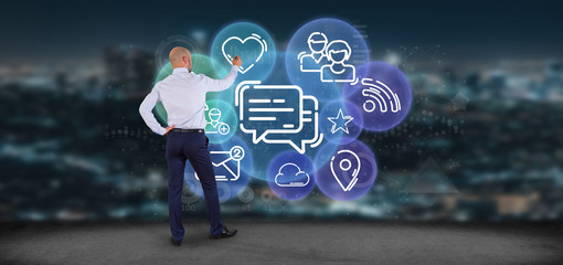 Businessman holding a cloud of social media network icon