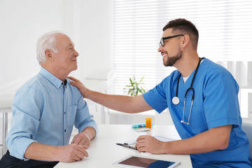 Sticker - Doctor examining senior patient in modern office