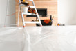 © New Africa - Stepladder and different tools in room. Interior renovation
