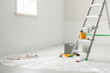 Canvas Print - Stepladder and different tools in room. Interior renovation