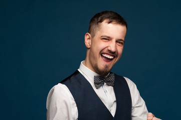 Portrait of a joyful young man in formal clothes