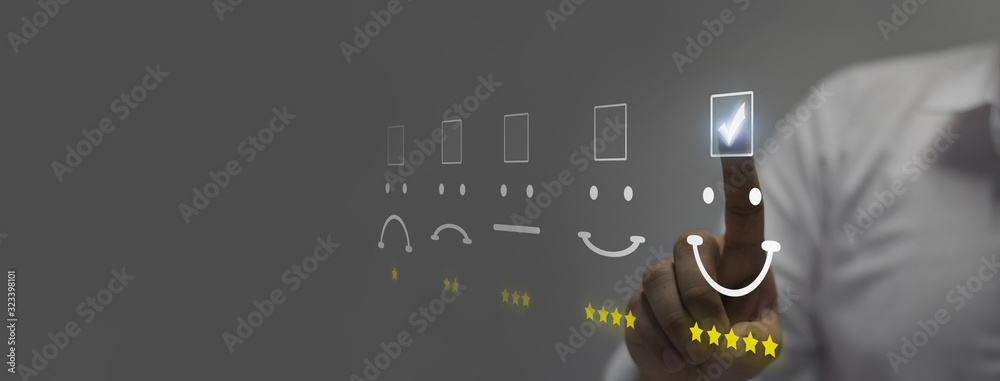 Businessman pressing smiley face emoticon on virtual touch screen. Customer service evaluation concep - obrazy, fototapety, plakaty 