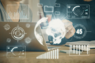 Forex graph with businessman typing on computer in office on background. Concept of analysis. Double exposure.