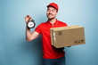 Courier is punctual to deliver the package. Emotional expression. Cyan background