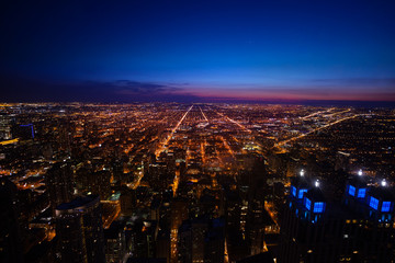 Wall Mural - Long view of Chicago city suburban panorama from above at night