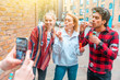 © william87 - Happy friends playing with soap bubbles together