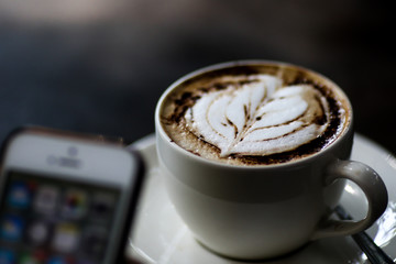 Latte coffee cup at coffee shop.