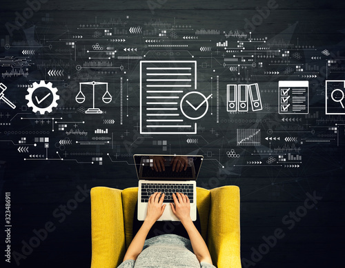 Fotografía Compliance concept with person using a laptop in a chair