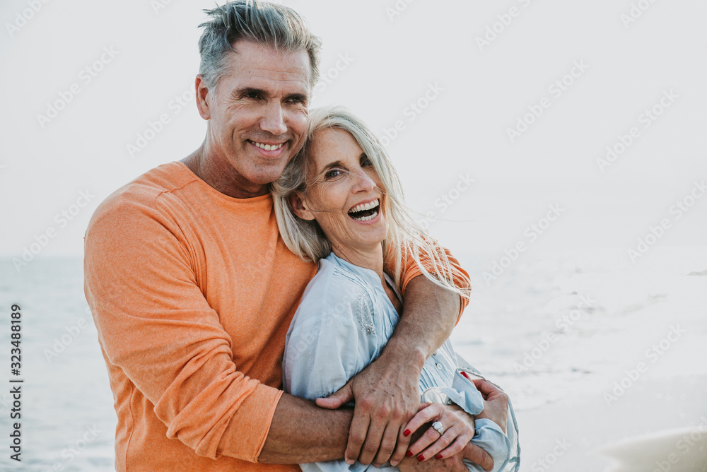 happy senior couple spending time at the beach. Concepts about love,seniority and people - obrazy, fototapety, plakaty 
