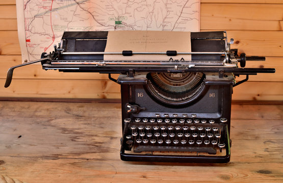 Old antique typewriter from first world war in grunge looks on a wooden table