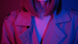 © koshkin_stock - High gorgeous fashion model posing in studio.Shooting of enchanting young woman with straight hair, touching face. Close-up footage in neon lights. Style, editorial. Colourful.