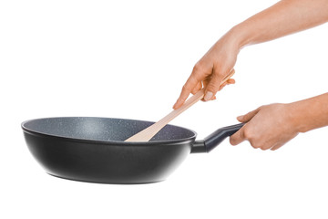 a pan in hands on a white background