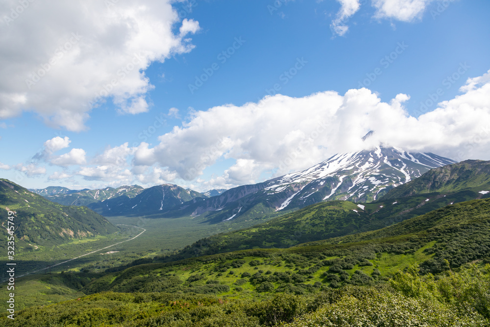 Vilyuchinsky volcano, Kamchatka peninsula, Russia. It is located southwest of the city of Petropavlovsk-Kamchatsky behind Avacha Bay. - obrazy, fototapety, plakaty 