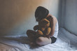 © AungMyo - concept photo of Sexual assault, young girl sit on a bed in a bedroom.