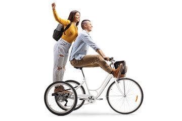 Poster - Young male and female riding on a tricycle