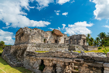 Tourists visi Mayan ruins in Tulum, Mexico