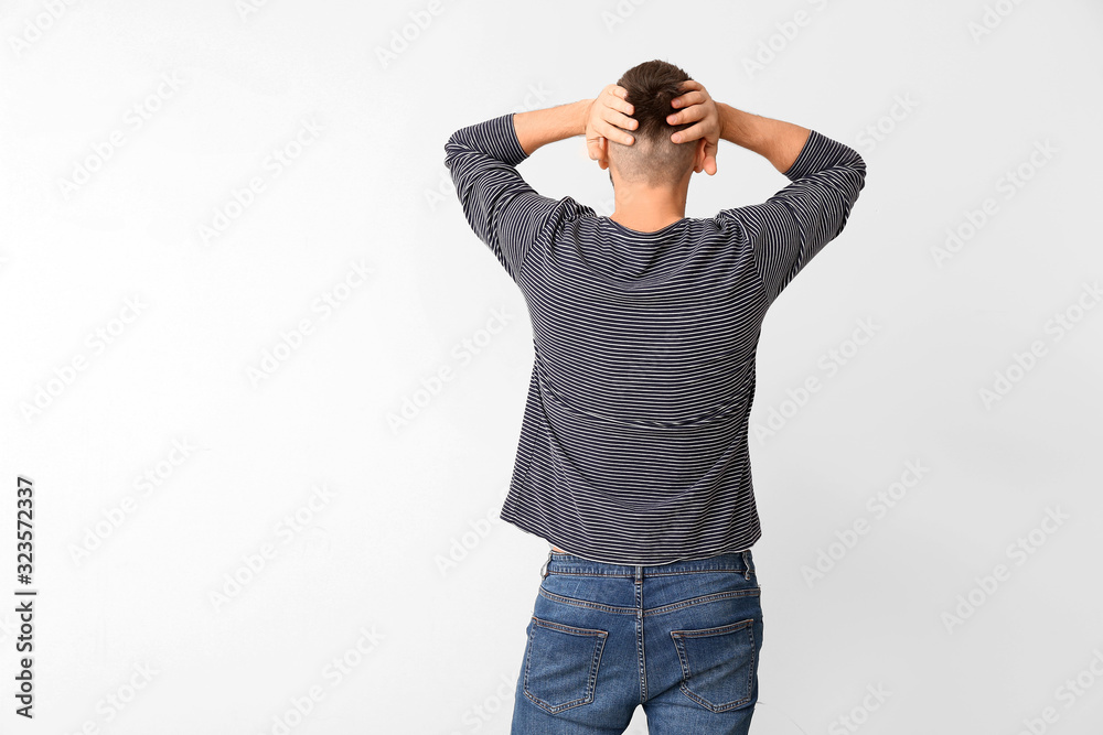 Stressed man on light background. Concept of choice