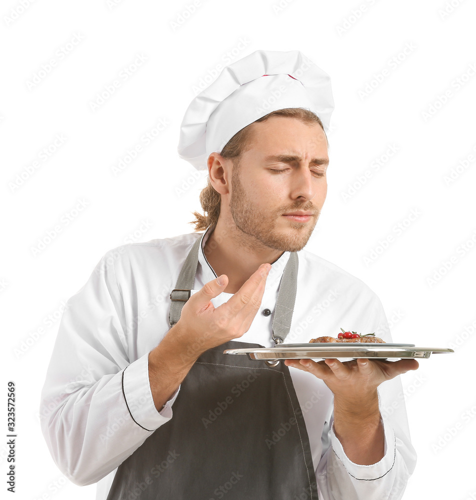 Happy male chef with prepared dish on white background