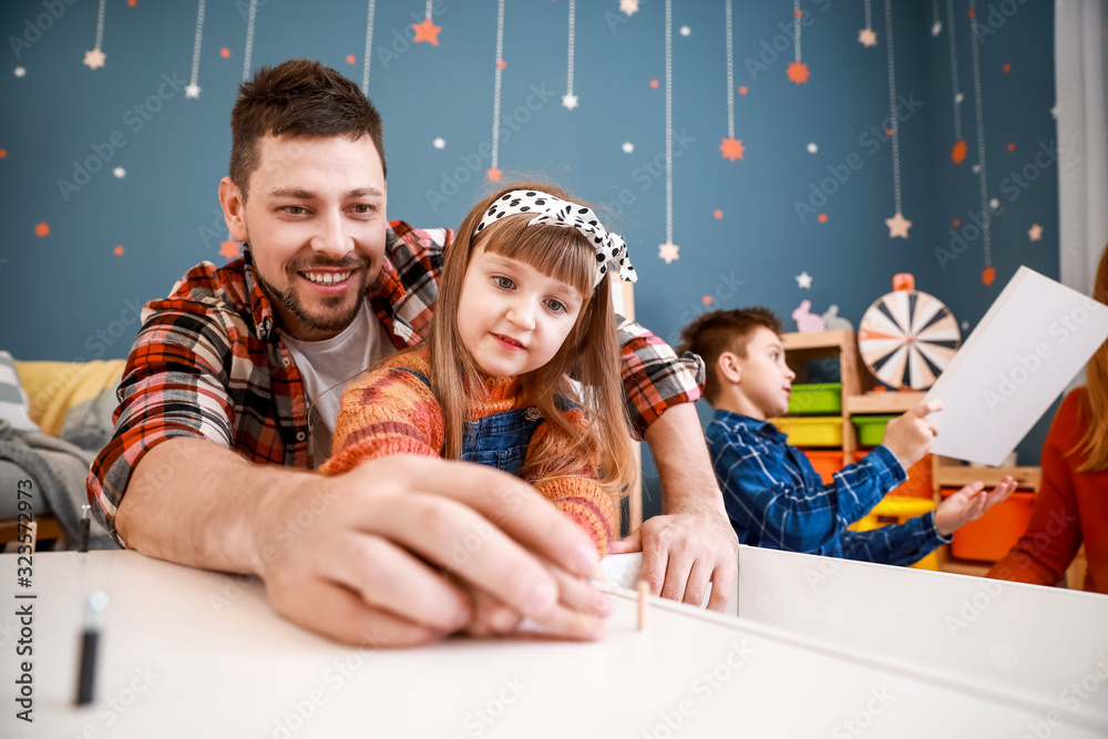Family assembling furniture at home