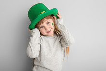 Funny Little Girl On White Background. St. Patrick's Day Celebration