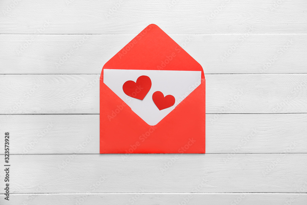 Paper envelope on wooden background
