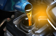 Refueling And Pouring Oil Quality Into The Engine Motor Car Transmission And Maintenance Gear .Energy Fuel Concept.