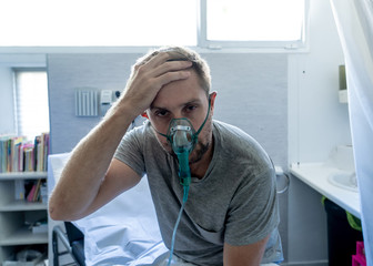 Wall Mural - Sick man with oxygen mask in emergency room at hospital