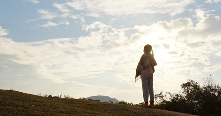 Poster - Woman look at the sky with sun flare light