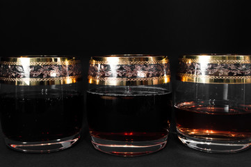 Wall Mural - Glass of dark red whiskey with cola