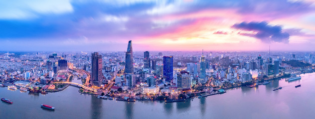 Top view aerial photo from flying drone of a Ho Chi Minh City with development buildings, transportation, energy power infrastructure. Financial and business centers in developed Vietnam.