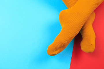 legs in colorful socks on colorful  background - Image