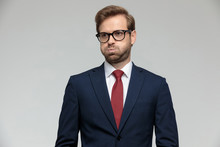 Businessman Standing And Puffing Cheeks Anxious