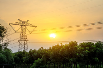 High voltage electricity tower and sunset sky landscape