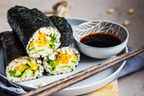Fototapeta  - Vegan nori wraps with rice, hummus, vegetables and seedlings.