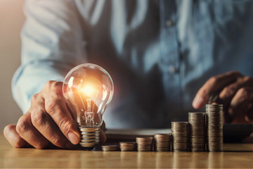 businessman hand holding light bulb. idea concept with innovation and inspiration. idea finance accounting