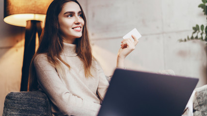 girl using bank card for buying things online. retail stores offering bonus cards for customers. sel