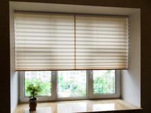 Pleated Blinds XL Coulisse, Beige Color, With 50mm Fold Closeup In The Window Opening In The Interior. Home Blinds - Modern Bottom Up Privacy Shades Half Raised On Apartment Windows.