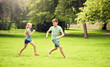 © Syda Productions - friendship, childhood, leisure and people concept - group of happy kids or friends playing catch-up game and running in summer park