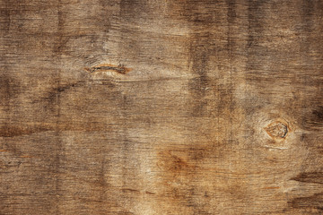 Wall Mural - Top view on the surface of an old stained brown wooden board. Abstract modern trendy wood texture background